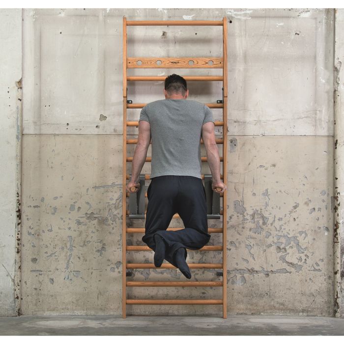 Man using NOHRD Wall Bars to perform a Dip  