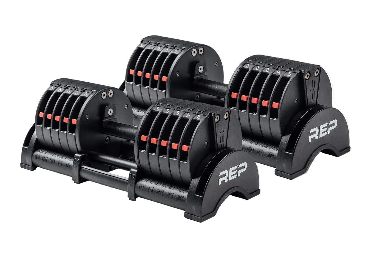 Set of adjustable dumbbells with REP branding on a white background